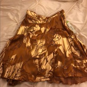 A gold skirt and a floral pair of balloon shorts